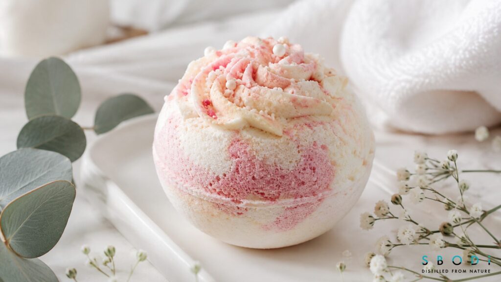 close up birthday cake bath bomb with pastel bath fizzer design