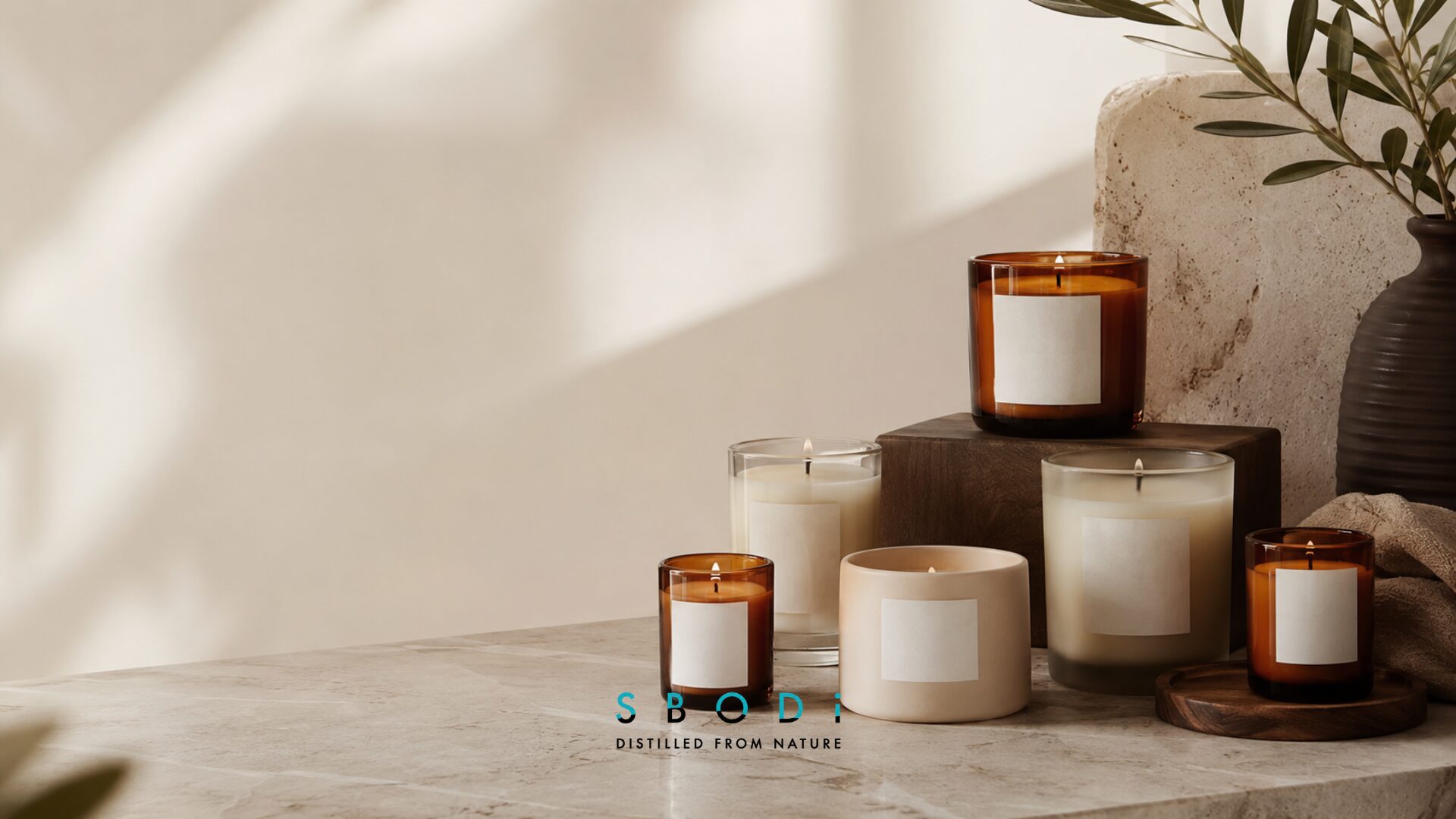 Amber candles displayed in premium glass vessels