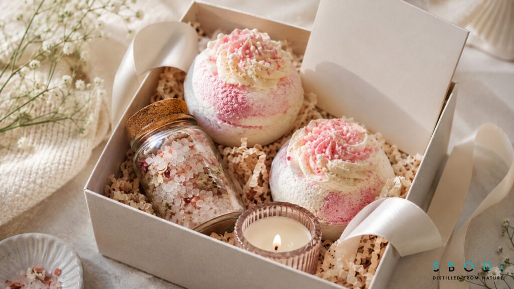 birthday cake bath bombs in self care gift box with candle and bath salts