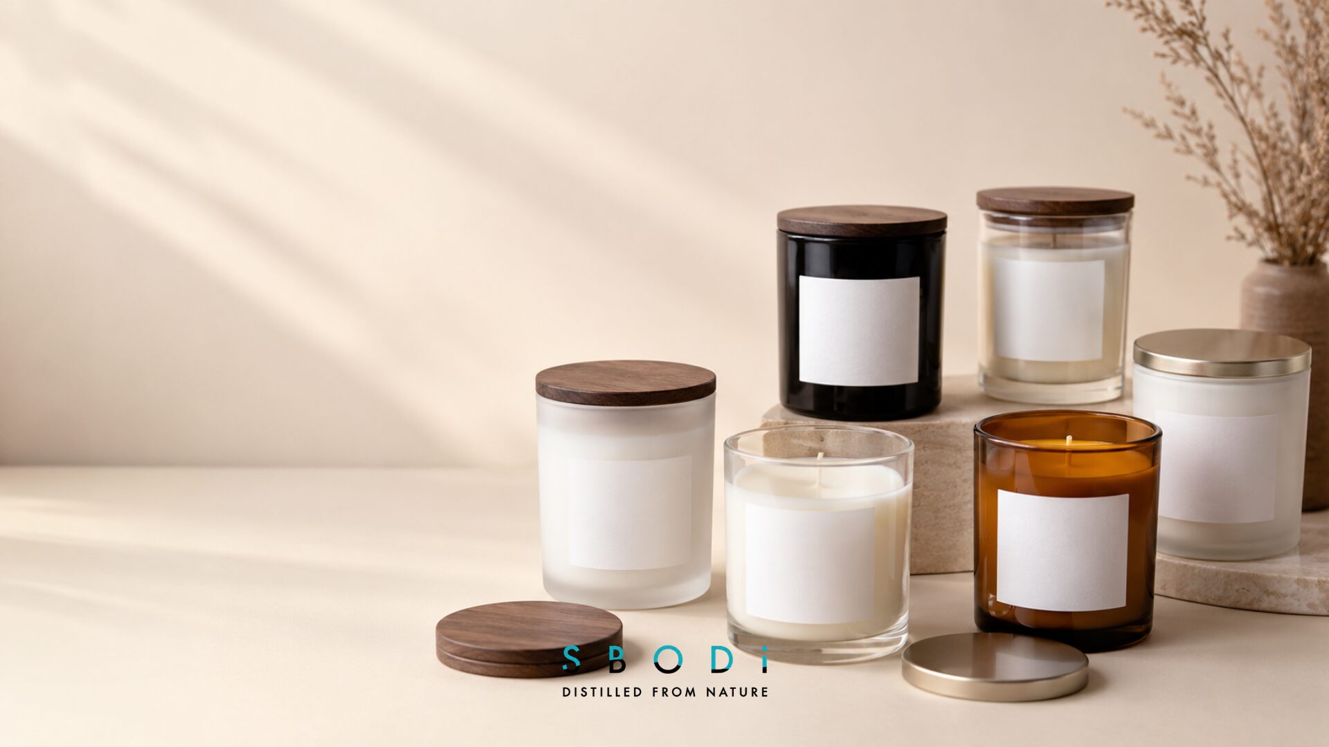 Clear, frosted, black, white, and amber glass tumbler candle styles